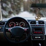 Divine Sansar-Golden Om Symbol Idol with Sparkling Stones-Car interior with dashboard and steering wheel, featuring a Golden Om Symbol Idol on the dashboard.