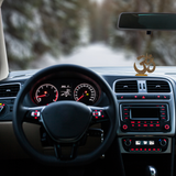 Divine Sansar-Golden Om Symbol Idol with Sparkling Stones-Car interior with dashboard and steering wheel, featuring a Golden Om Symbol Idol on the dashboard.