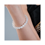Divine Sansar-LunaGlow Bracelet-Moonstone bracelet on a wrist with a neutral background