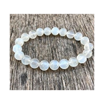 Divine Sansar-LunaGlow Bracelet-Moonstone bracelet on a wooden surface