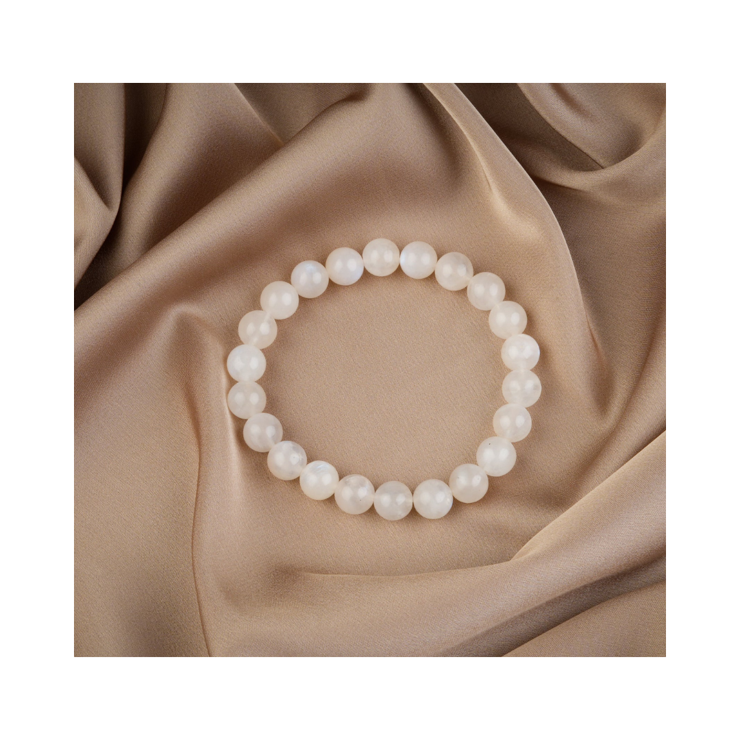 Divine Sansar-LunaGlow Bracelet-Moonstone bracelet on a beige fabric background
