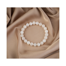 Divine Sansar-LunaGlow Bracelet-Moonstone bracelet on a beige fabric background