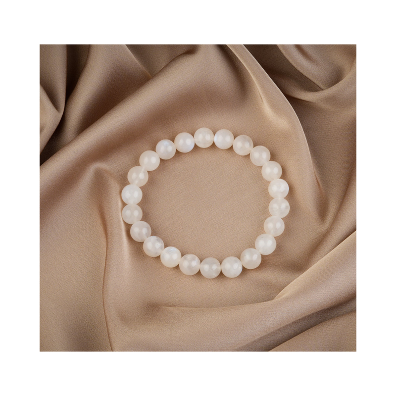 Divine Sansar-LunaGlow Bracelet-Moonstone bracelet on a beige fabric background