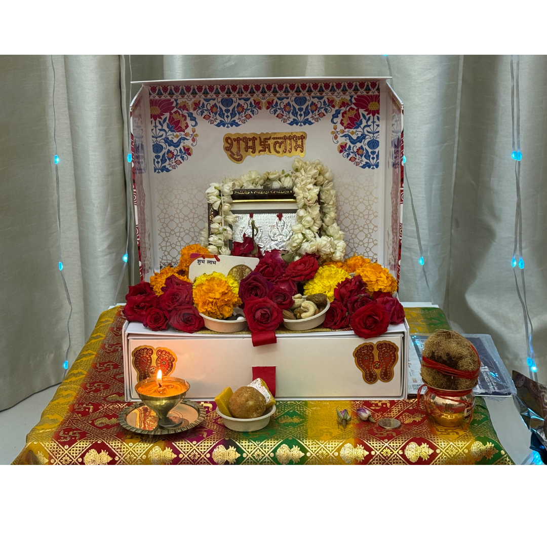 Divine Sansar-Mangal Bhawan : Personal Portable Temple-Decorative altar with flowers, candles, and religious items on a white curtain background