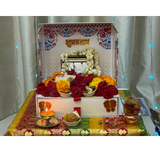 Divine Sansar-Mangal Bhawan : Personal Portable Temple-Decorative altar with flowers, candles, and religious items on a white curtain background