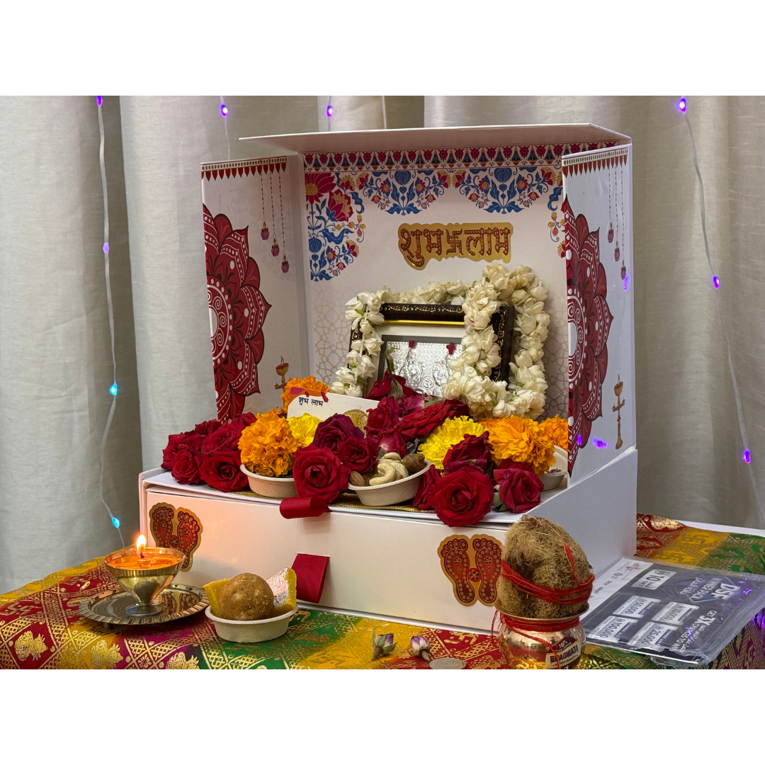 Divine Sansar-Mangal Bhawan : Personal Portable Temple-Decorative altar with flowers, candles, and religious items on a table.
