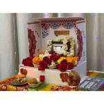 Divine Sansar-Mangal Bhawan : Personal Portable Temple-Decorative altar with flowers, candles, and religious items on a table.