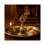 Divine Sansar-Morpankh Ghanti - Peacock-Feather Pooja Bell kept on a pooja thali with a lit diya, kumkum, haldi and flowers