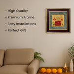 Divine Sansar Pyrite Stone Frame with Vyapar Vridhhi Yantra with decorative items on a table below.