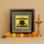 Divine Sansar-Shani Yantra on Raw Pyrite Frame on a beige background with diyas and flowers