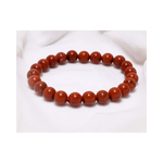 Divine Sansar-Stability Bracelet-Red Jasper bracelet on a white fabric background