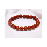 Divine Sansar-Stability Bracelet-Red Jasper bracelet on a white fabric background