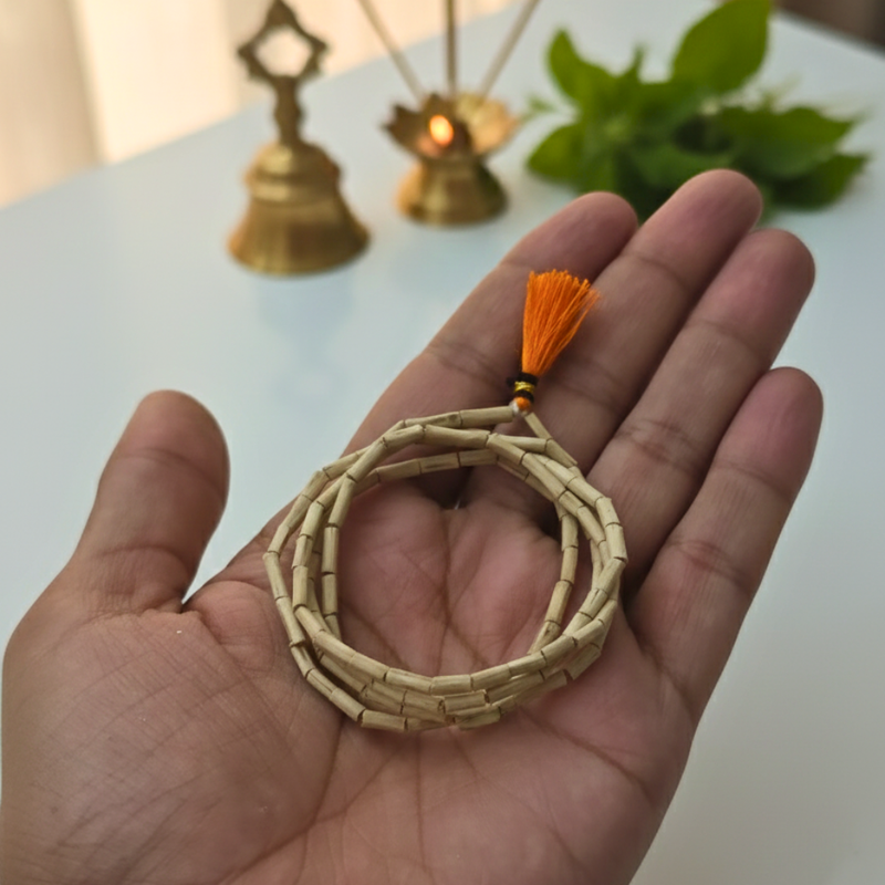 Divine Sansar-Tulsi Khanti Maala on a palm