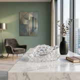 Divine Sansar Wish Fulfilling Crystal Turtle Modern Ambiant-Modern living room with a crystal Turtle on a marble table, a vase, and a book.