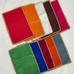 Divine Sansar-Set of colorful fabric squares with a gold border on a white background