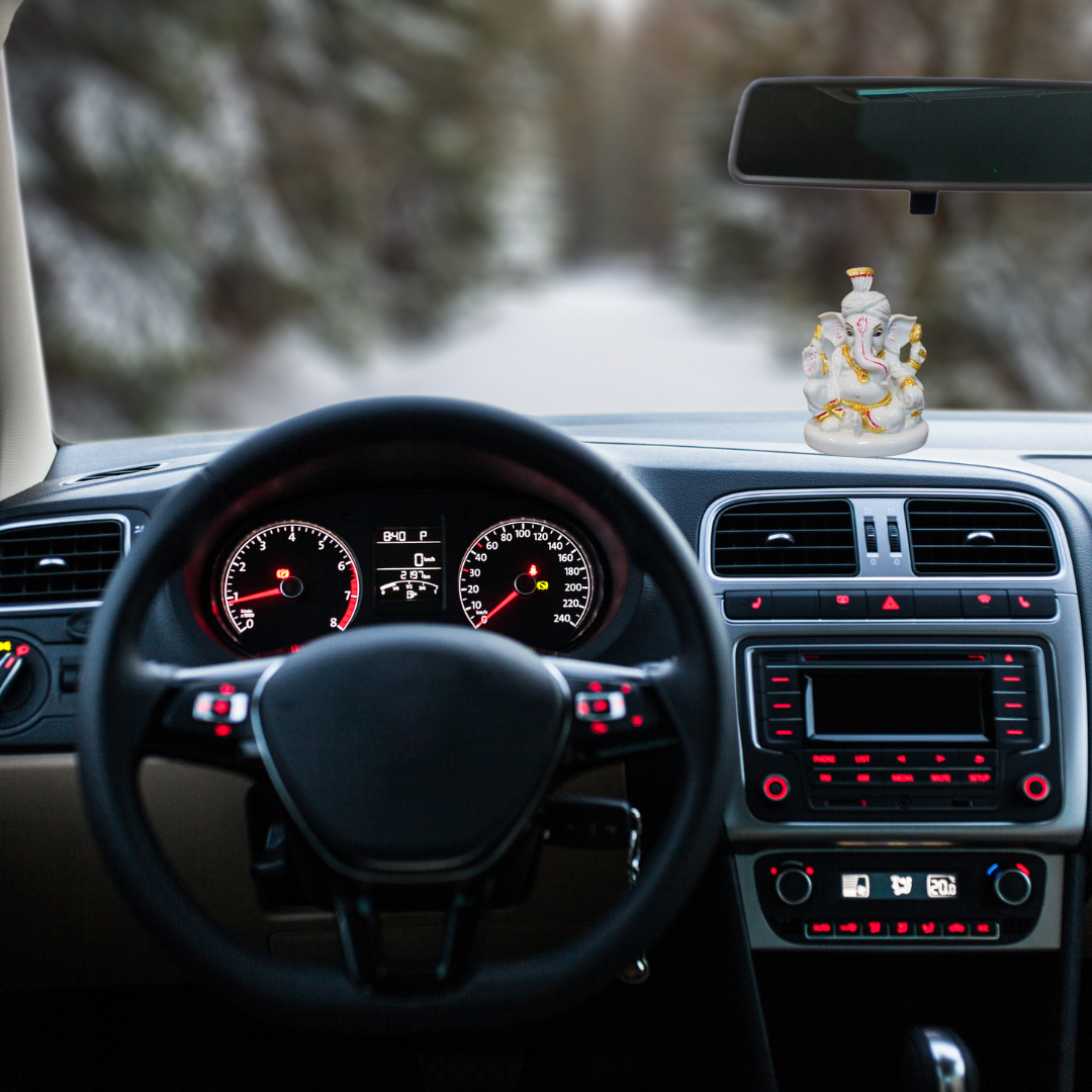 Divine Sansar-Ganesh Murti Porcelain-Car interior with Ganesha statue on the dashboard