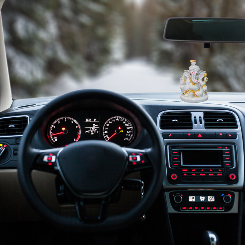 Divine Sansar-Ganesh Murti Porcelain-Car interior with Ganesha statue on the dashboard