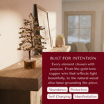 Geniune Pyrite Stone Tree of Life on a wooden surface with text about its purpose and benefits.