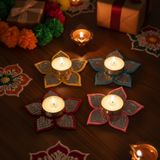Divine Sansar Glass Work Lotus Tealight Holder Set on a wooden surface with flowers and gift boxes in the background.