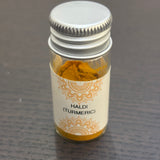 Divine Sansar Haldi Powder (Turmeric) bottle on a dark surface