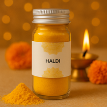 Divine Sansar-Jar of Haldi powder with a decorative label on a warm-toned background.