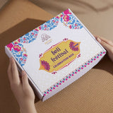 Divine Sansar-A rectangular white and yellow gift box labeled "Holi Festival Celebration Box"