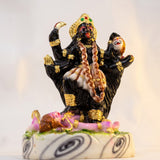 Close-up of Kali Maa murti showing gold crown, sword and mundamala - Divine Sansar