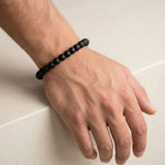Karungali ebony bracelet worn on a man's wrist - Divine Sansar
