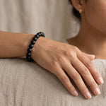 Karungali ebony bracelet worn on a woman's wrist - Divine Sansar