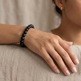 Karungali ebony bracelet worn on a woman's wrist - Divine Sansar