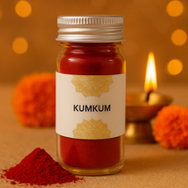 Divine Sansar-Bottle of kumkum with decorative elements on a warm background