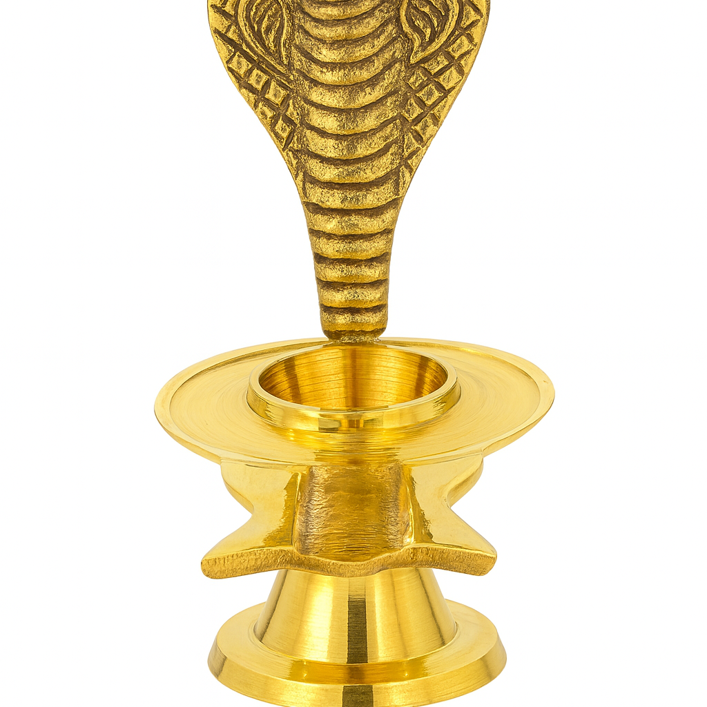 Divine Sansar-A golden brass Narmadeshwar Shivling stand featuring a multi-layered base and an upright, engraved hooded cobra (Sheshnag) backdrop.