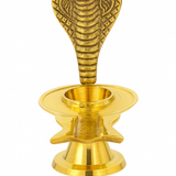 Divine Sansar-A golden brass Narmadeshwar Shivling stand featuring a multi-layered base and an upright, engraved hooded cobra (Sheshnag) backdrop.
