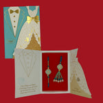 Divine Sansar-Premium Bhaiya Bhabhi Rakhi Design 5, with a decorated card,  on a red background.