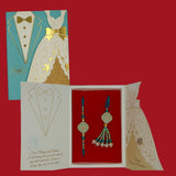 Divine Sansar-Premium Bhaiya Bhabhi Rakhi Design 5, with a decorated card,  on a red background