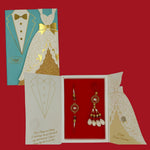 Divine Sansar-Premium Bhaiya Bhabhi Rakhi Design 6, with a decorated card, on a red background.