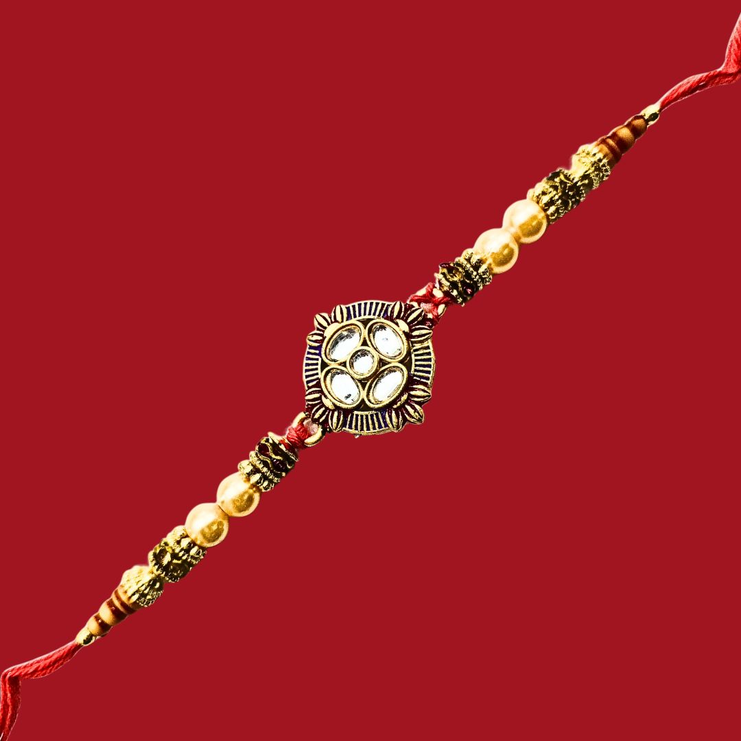 Divine Sansar Premium Designer Rakhi on a red background