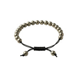 Divine Sansar-Pyrite Braided front loose-Pyrite Braided bracelet with black cord on a white background