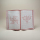 Divine Sansar-Ram Naam writing book inside divine sansar UAE-Open notebook with grid pages and pink floral design on a white background