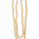 Divine Sansar-Tulsi Beads Mala with a red tassel on a white background