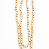 Divine Sansar-Tulsi Beads Mala with a red tassel on a white background