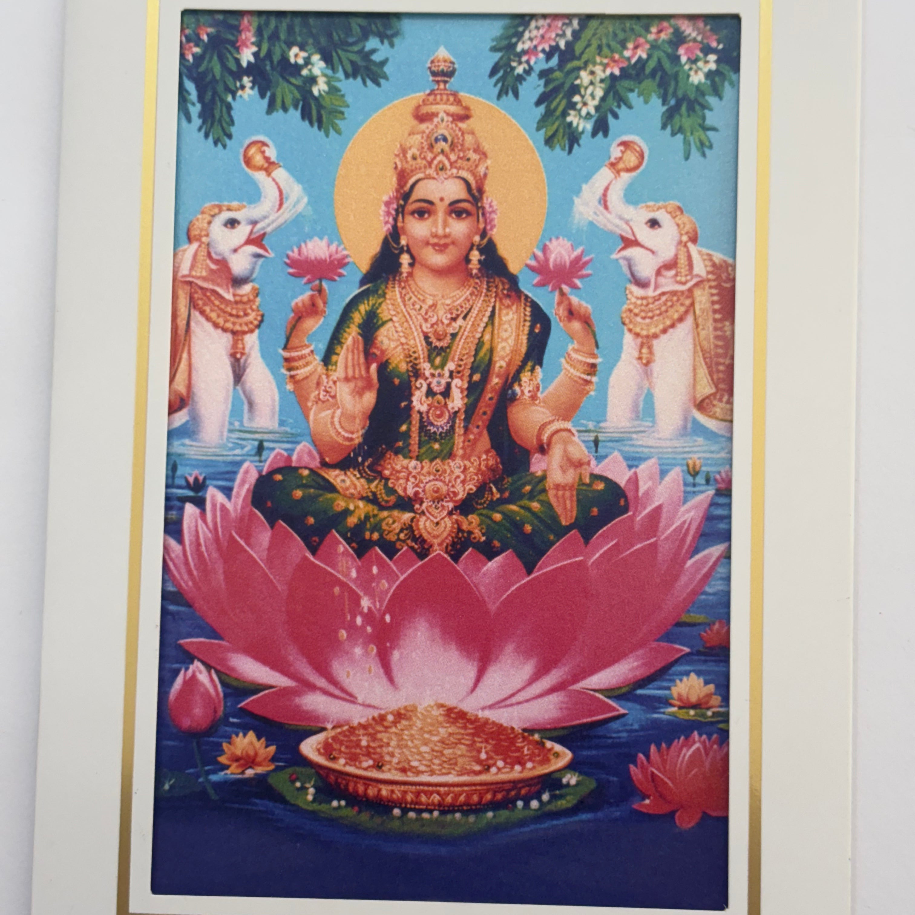 Divine Sansar Vaibhav Laxmi Photo Frame on a pink lotus with two elephants and flowers in the background.