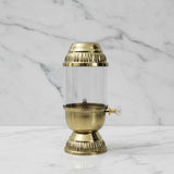 Brass akhand diya lantern with glass chimney on white marble - Divine Sansar UAE