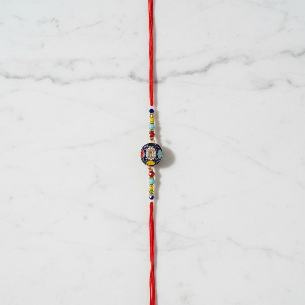 Aumkara Om Meenakari Rakhi on marble - Divine Sansar UAE