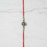 Aumkara Om Meenakari Rakhi on marble - Divine Sansar UAE