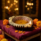 Big clay mitti diya lit with ghee and a cotton wick at the spout, agal vilakku for Diwali - Divine Sansar