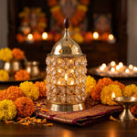 Lit Crystal Diya oil lamp with marigold decor - Divine Sansar
