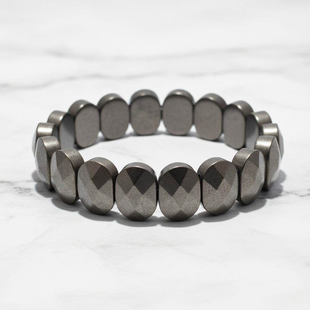 Flat faceted pyrite bead bracelet on white marble - Divine Sansar UAE