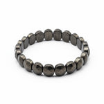 Top view of flat pyrite stretch bracelet money magnet - Divine Sansar