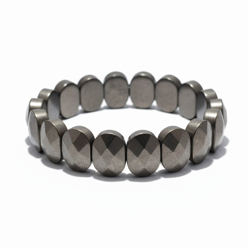 Flat pyrite bracelet with 20 faceted oval beads on white background - Divine Sansar